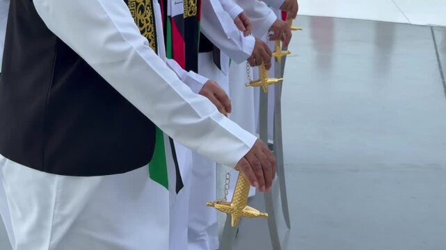 A revered Emirati folk dance performed with rhythmic chanting and synchronized movements during UAE National Day celebrations.