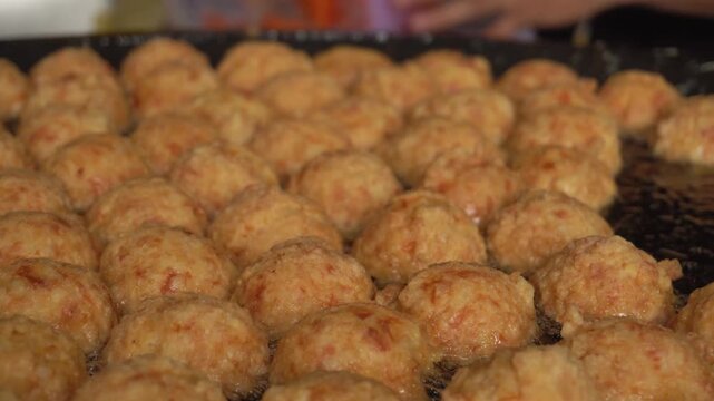 Close-Up Crispy Fried Meatballs in Hot Oil, Street Food Concept
