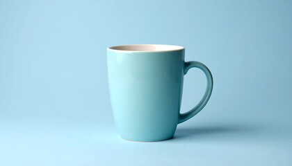 A simple light blue ceramic mug on a light blue background.