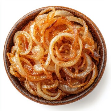 Fried onions placed on a plate, isolated on a white background, garnished to enhance their appealing look and deliciousness.