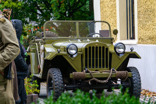 Vintage Soviet GAZ-67 military jeep "Chapayev", historical WW2 off-road vehicle, military vehicle reconstruction details, antique army truck displayed at historical reenactment event.