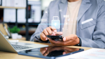 Business professional using smartphone with digital lock and security interface. Concept of mobile...