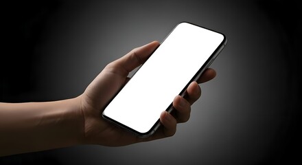 Human Hand Holding Blank Smartphone Display Against Dark Backdrop with Focused Lighting and High Contrast