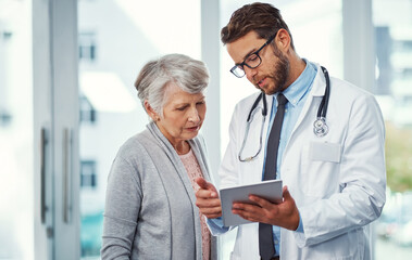 Doctor, tablet and consulting with old woman in hospital for advice, mammogram test results and healthcare. Breast cancer screening, online medical research and oncology checkup with people in clinic © JamPacked/peopleimages.com
