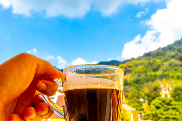 Fototapeta premium Black coffee with tropical landscape terrace balcony panorama view Thailand.