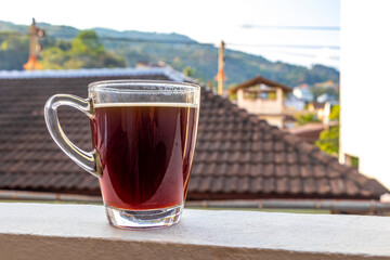 Fototapeta premium Black coffee with tropical landscape terrace balcony panorama view Thailand.