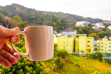 Fototapeta premium Black coffee with tropical landscape terrace balcony panorama view Thailand.