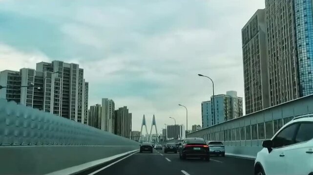 Real-life footage of driving on urban roads and traffic on elevated bridges