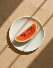 Watermelon Slice on White Plate with Linen Background Top View