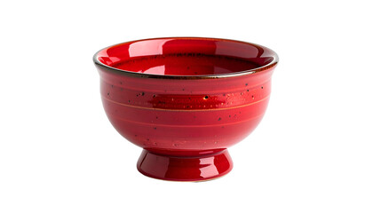 Close-up of a vibrant red ceramic bowl with a pedestal base, isolated on black