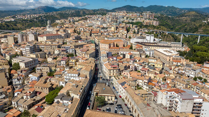 Fototapeta premium Aerial view of the historic center of Catanzaro, located in southern Italy. It is the regional capital of Calabria and is perched on the hills. It is a sunny summer morning.