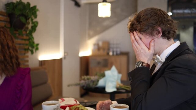 The girl suddenly slaps the guy across the face after his hurtful words creating a sharp emotional moment on their date as tension rises and both react to the abrupt conflict