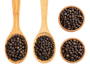 Black peppercorns in wooden spoons and bowls against a black backdrop