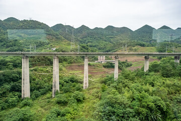 Fototapeta premium A complex high-speed elevated railway line under construction, designed to allow trains to travel at speeds of around 350 kilometers per hour