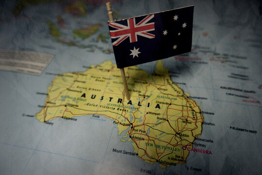 Australian national flag pinned on a world map highlighting Oceania geography and global connection