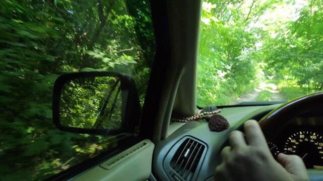 inside the car. driver behind the wheel. drive a car. journey. bad roads. by car . steering wheel and dashboard. wheels and engine.