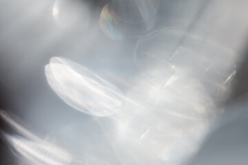 Light leak abstract background in neutral colors from defocused flare and glare with caustic effect. Sunlight blurred overlay texture for modern presentation.