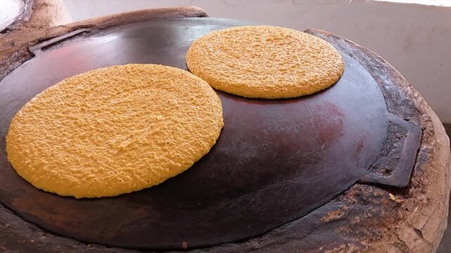 Cooking cachapas on a griddle in Zamuro, Venezuela&rsquo;s Monagas state