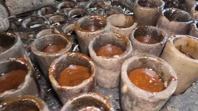 Sugar cane syrup cooling in molds at El Paradero, Sucre, Venezuela