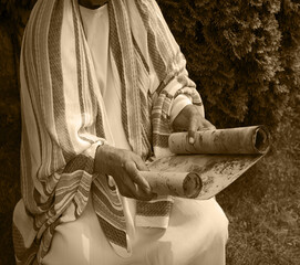 Old man reading the scroll