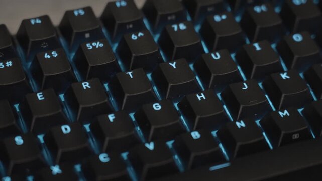 Gaming keyboard in close up with blue colors.