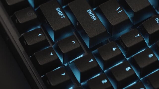 Passing slowly and smoothly in extreme close up over the RGB illuminated keys.