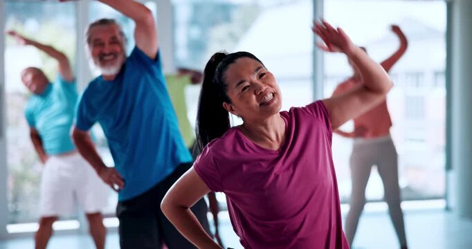 Stretching, elderly people and happy in class, flexibility and exercise to prevent muscle stiffness. Gym, old women and workout with senior men, personal trainer and active for fitness and wellness