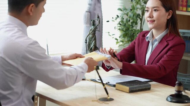 The concept of law and justice: The lawyer provides legal advice to young female lawyers, discusses legal documents, and offers guidance on important cases.