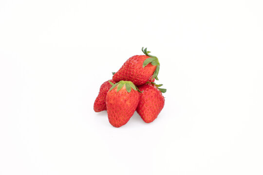 Fresh organic akihime strawberries on white background.