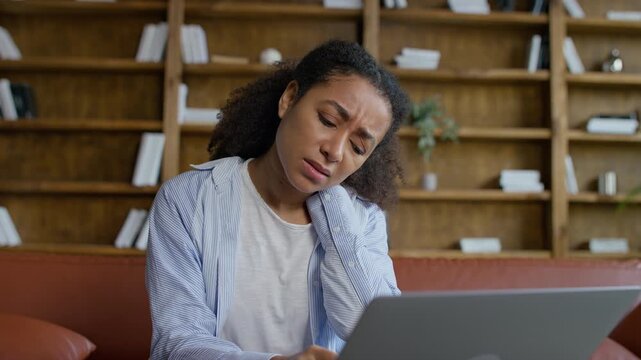 Tired woman with neck pain from working