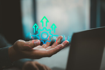 Businessman Hand Showing Gear and Growth Arrows with Financial Chart Overlay