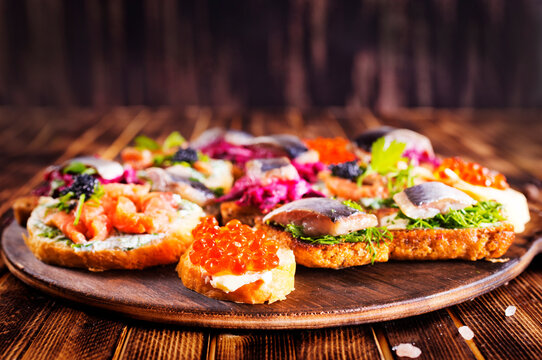 Bread Brushetta with fish, salami and cheese.