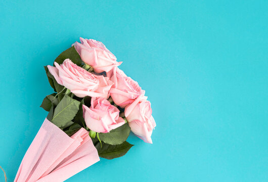 Pink roses on blue backdrop for mother's day