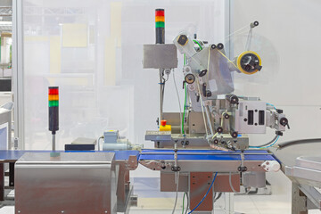 Automated Labeling Machine at Conveyor Belt Food Production Factory