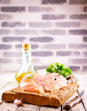 raw organic chicken breast on stone