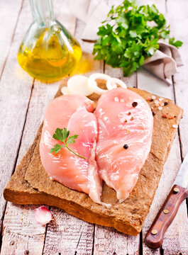 raw organic chicken breast on stone