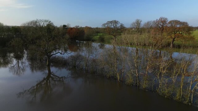 Flooded fields along Malton Bypass A64 RIver Derwent, tranquil rural scene, nature textures
