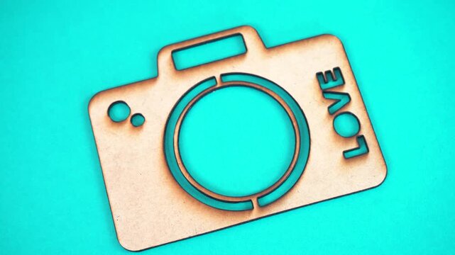 MDF camera cutout with 'LOVE', showcasing craft and creativity