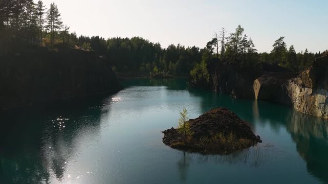 Aerial view over a turquoise lake, copper ore, sunny day at Orajarvi, Finland