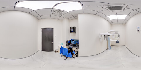 Fototapeta premium A clean 360 degree equirectangular view of a professional dental diagnostic room featuring a panoramic xray machine, medical computer desk, and sterile clinical interior.