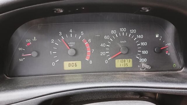 Car dashboard with a moving tachometer needle