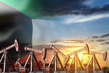 Oil pumpjacks with Kuwait flag against the sunset. Kuwait Oil Industry concept