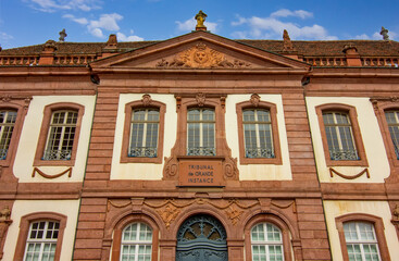 Ornate historic government palace facade with classical windows and stone details in Colmar.