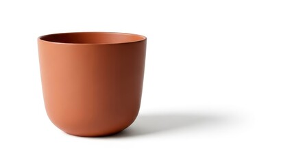 Minimalist terracotta cup or planter on a white background with a subtle shadow, offering a clean and modern aesthetic.