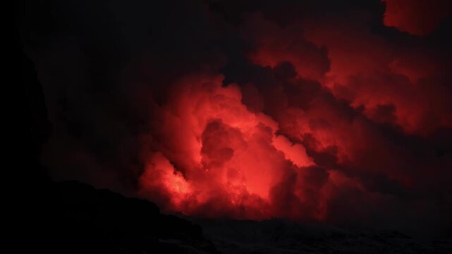 Dramatic volcanic lava flow entering the ocean on the Big Island of Hawaii. Glowing molten lava meets seawater, creating intense steam clouds and fiery red light against a dark coastal landscape.