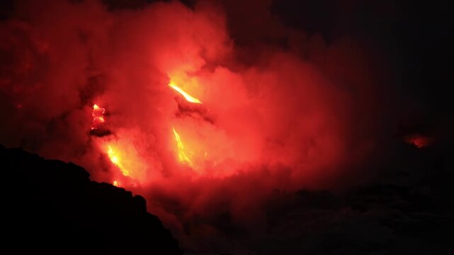 Dramatic volcanic lava flow entering the ocean on the Big Island of Hawaii. Glowing molten lava meets seawater, creating intense steam clouds and fiery red light against a dark coastal landscape.