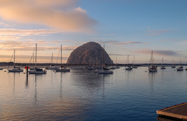 Obraz premium View of Morro Rock at sunset, California, USA. Morro Rock is a volcanic plug in Morro Bay, California, on the Pacific Coast.