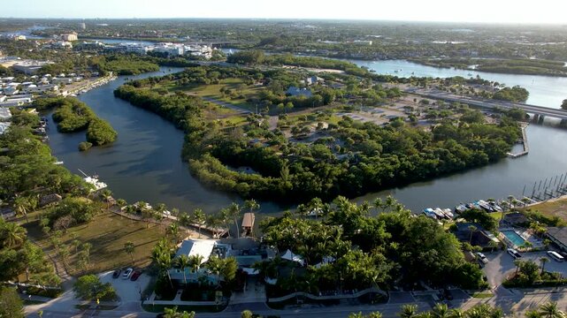Aerial view of the Loxahatchee River winding through lush greenery and waterways, Jupiter, Florida, United States.