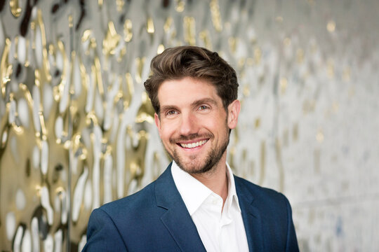 Portrait of smiling businessman in a foyer