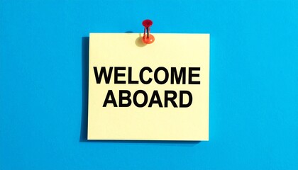 "Yellow sticky note with red paperclip on blue background, bold text WELCOME ABROAD, travel visual"